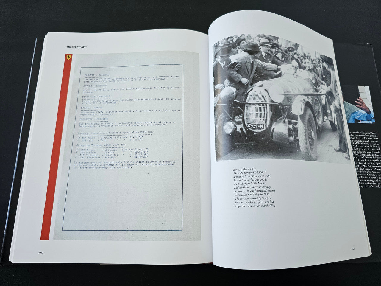 Open book with a document-style page and a black-and-white race car photo