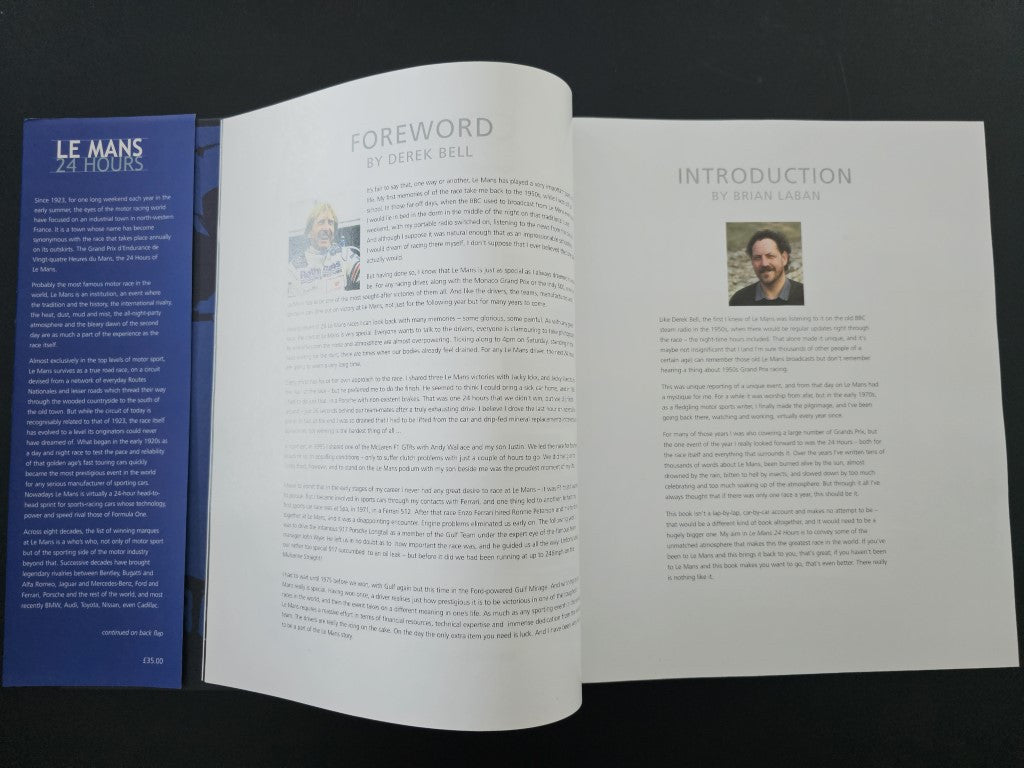 Open book with foreword and introduction pages facing up, with author portrait