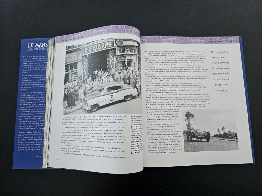 Open book with vintage black-and-white car photo on the left page