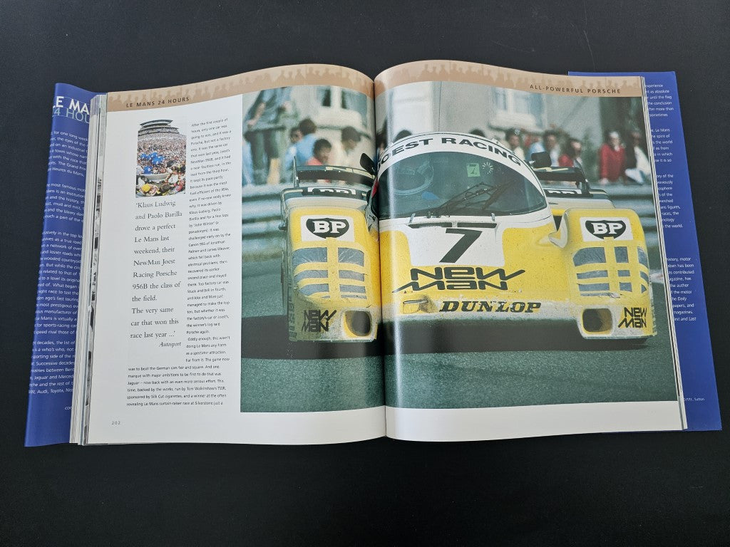 Open book spread featuring a front view of a yellow race car across both pages