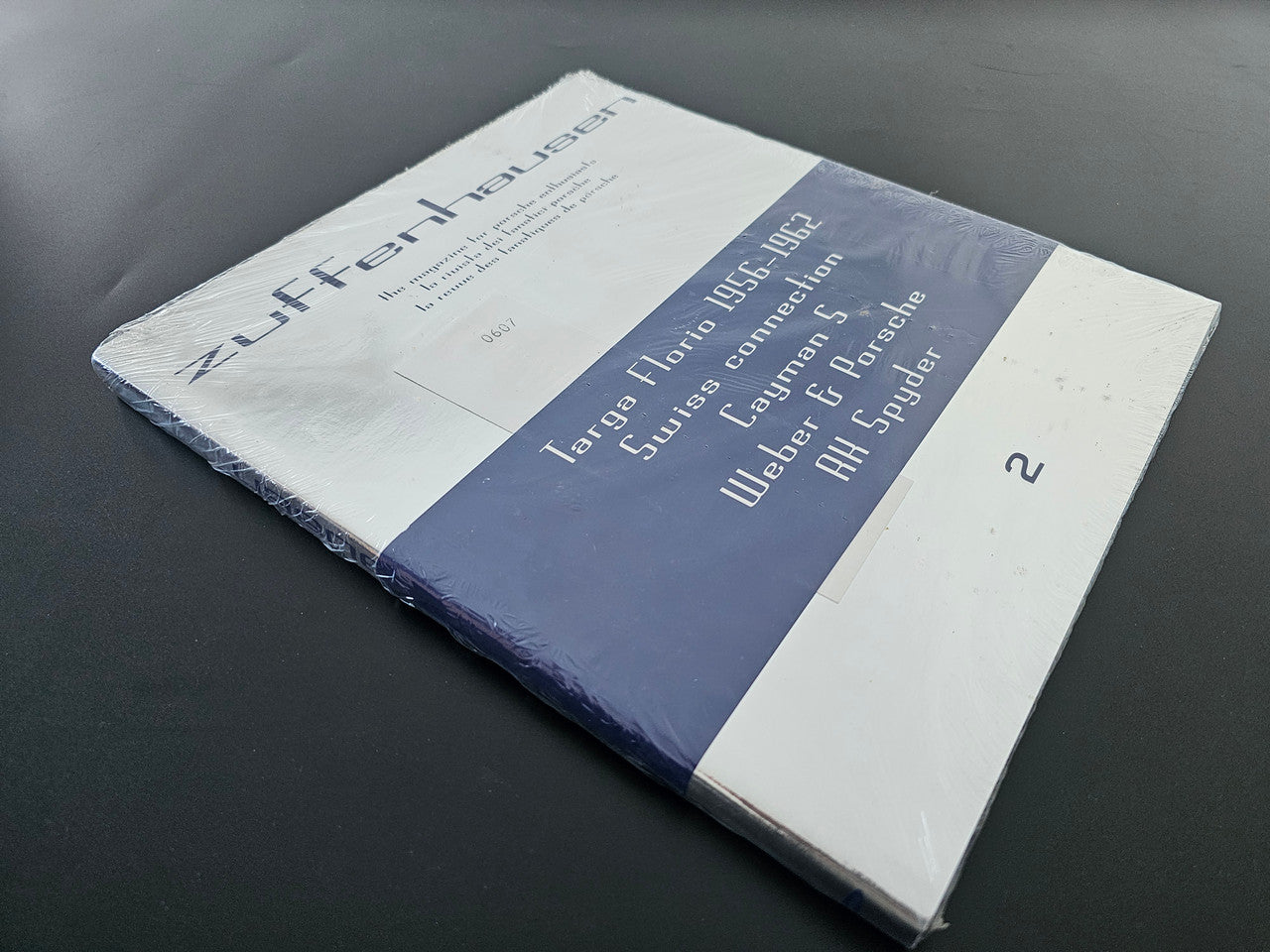 Magazine with blue-and-white cover and title typography, angled view