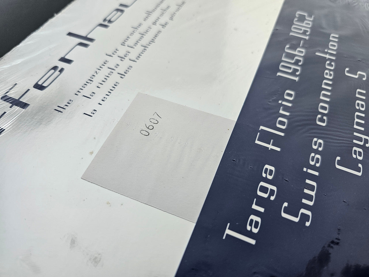 Magazine cover close-up with white panel and blue section, large text blocks