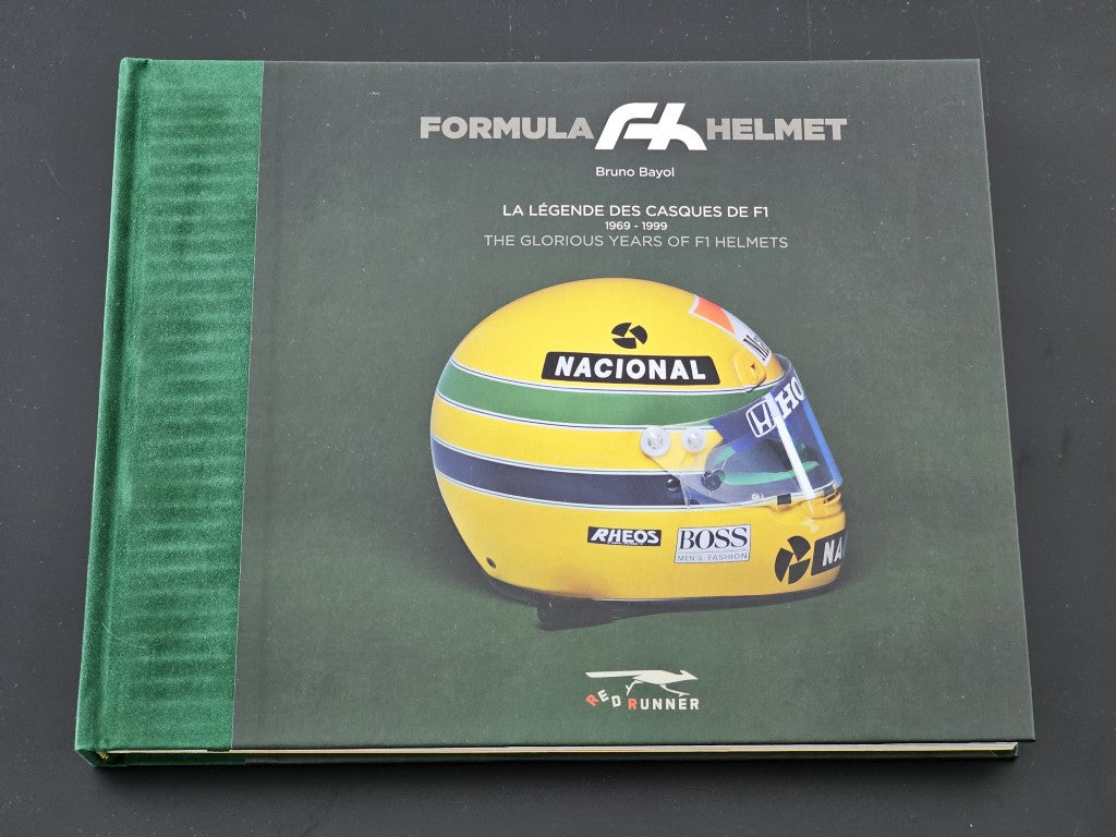 Green hardcover helmet-themed book with yellow helmet illustration on the front cover.
