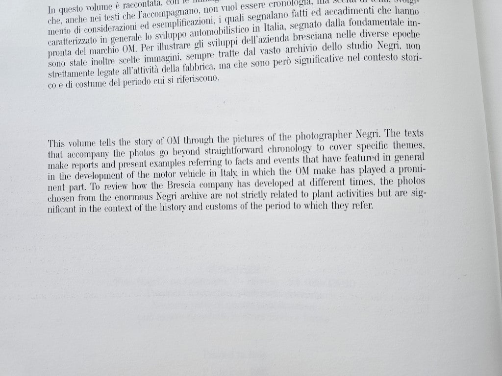 Photo history book page with dense printed text in paragraph form.