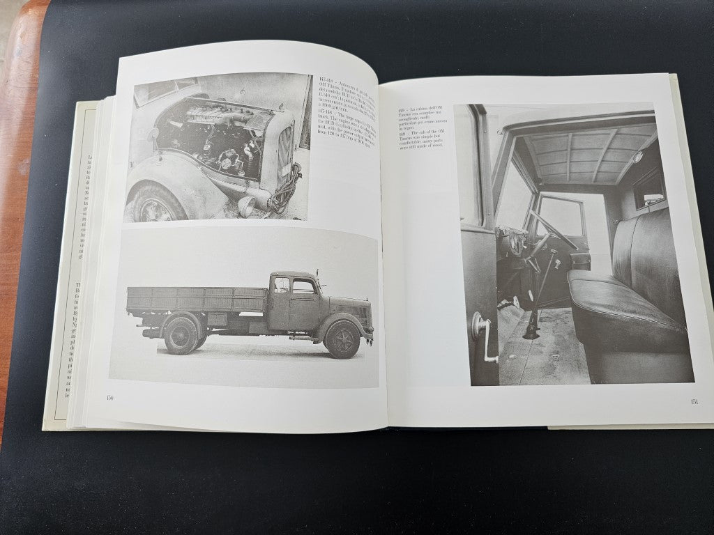 Open book with black-and-white photos of vintage vehicles and interiors