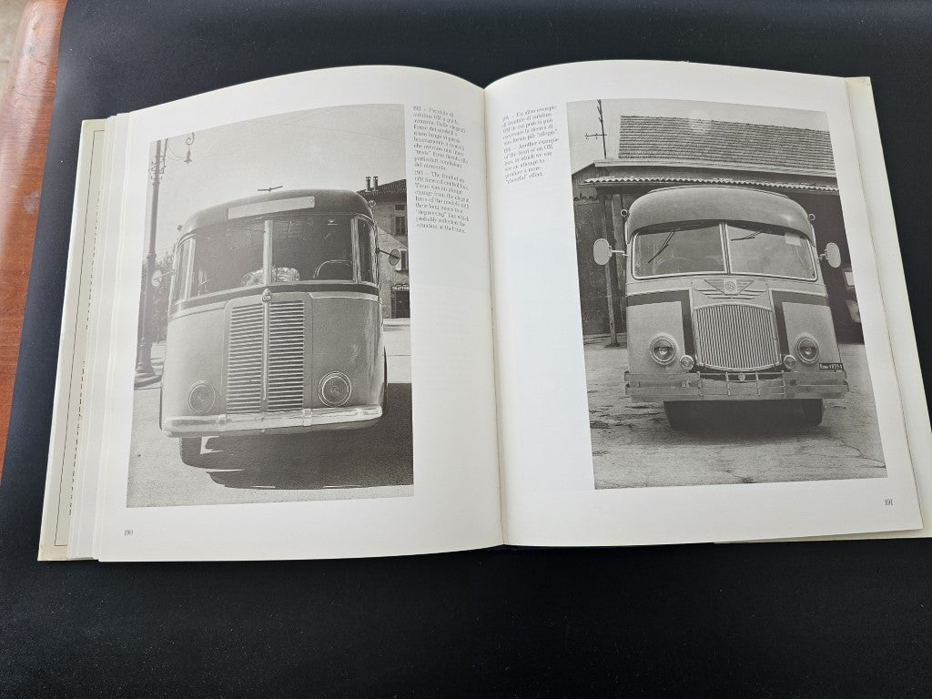 Open book with black-and-white photos of vintage vehicles, front views