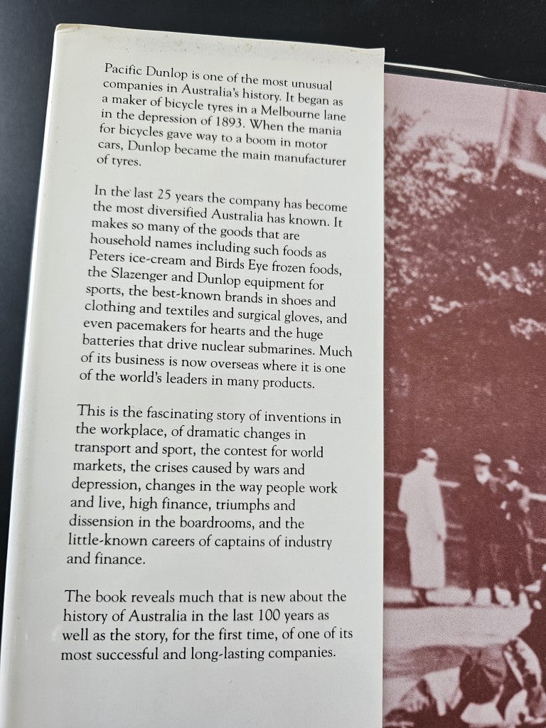 Book open to a text page with paragraphs and a small black-and-white photo at right