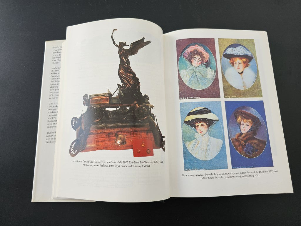 Book open spread with a black statue illustration on the left and portrait artwork tiles