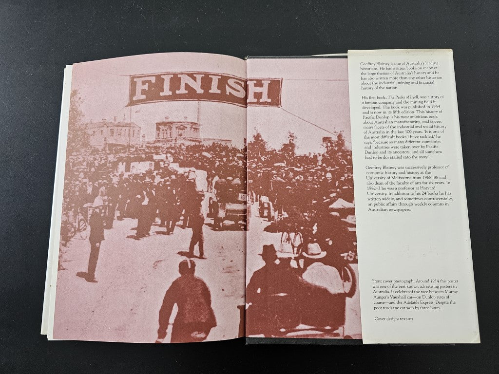 Open book with large 'FINISH' headline and crowd scene across two pages