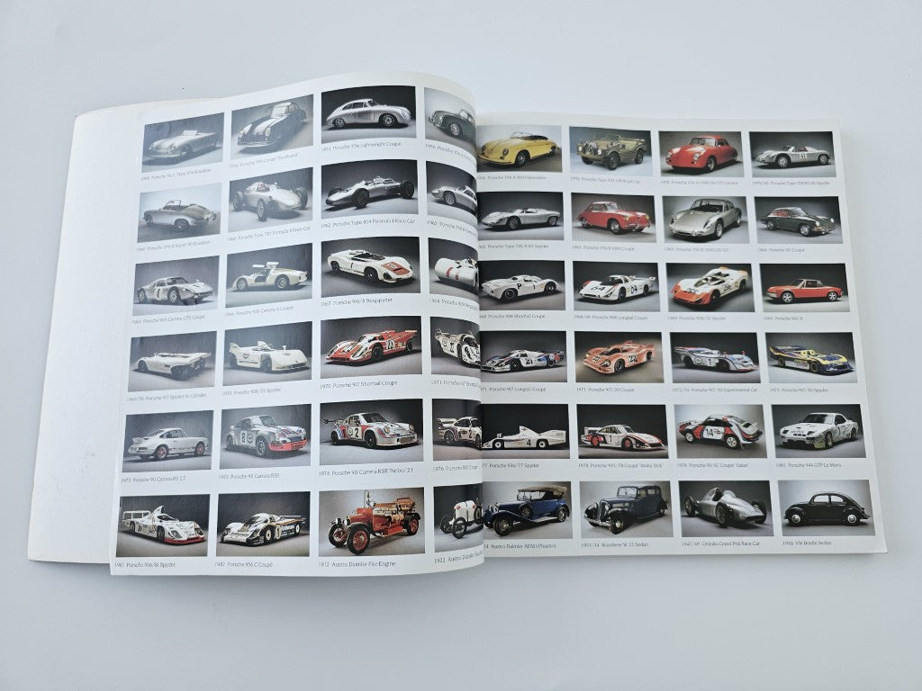 Porsche Museum vehicle documentation book, open spread with grid of car photos