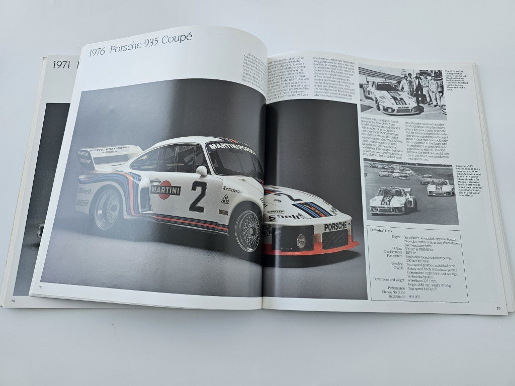 Vehicle history book: open spread with 1976 Porsche 935 Coupé race car photo.