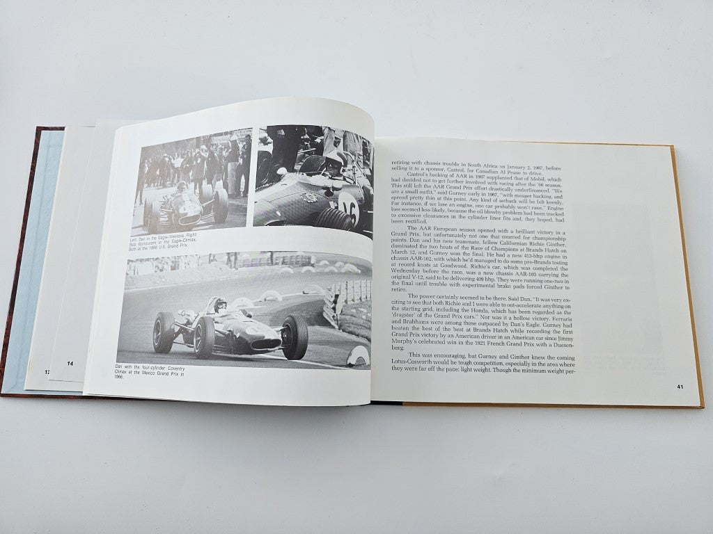 Open book spread with black-and-white race car photos across two pages and text.