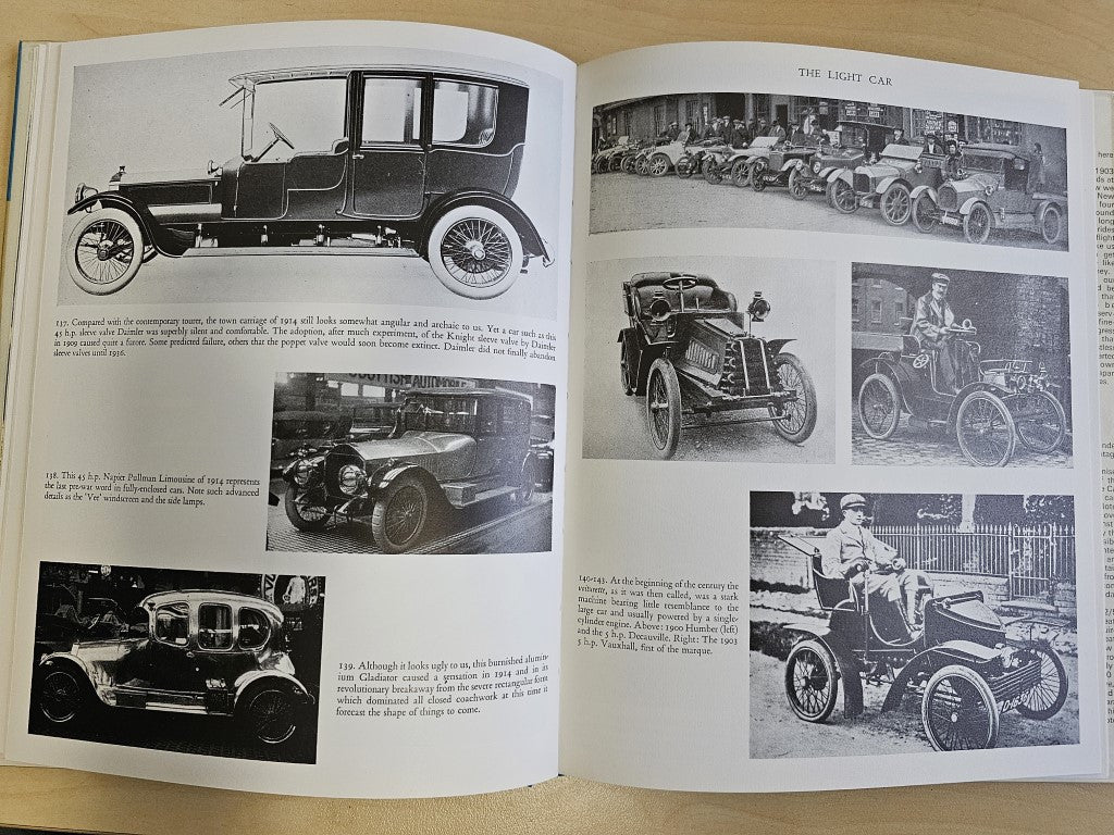 Open book with side-view vintage car photos and small inset details