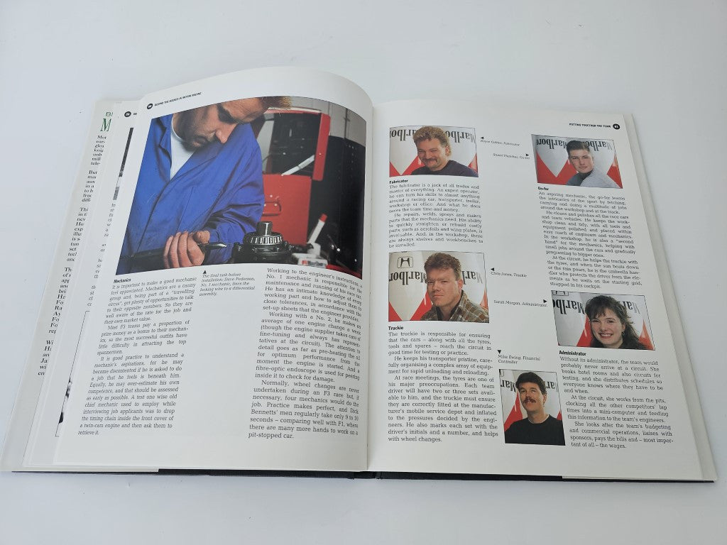 Motor racing book open to interview pages with multiple portrait photos