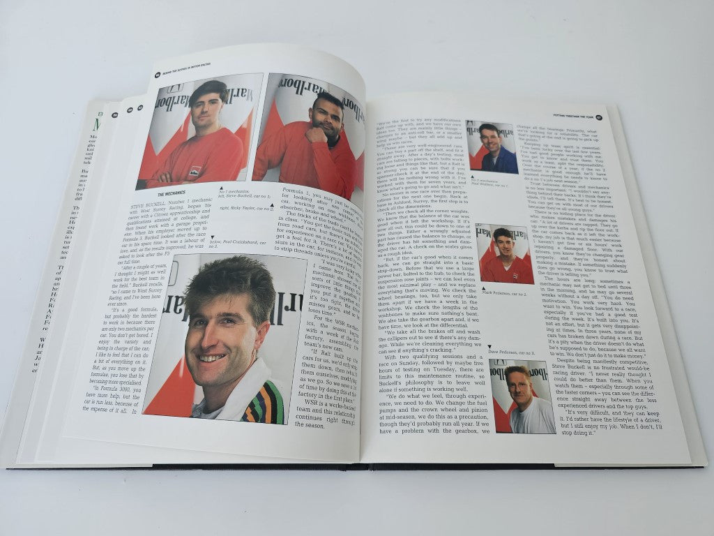 Motor racing book open to interview spread with headshot photos in red