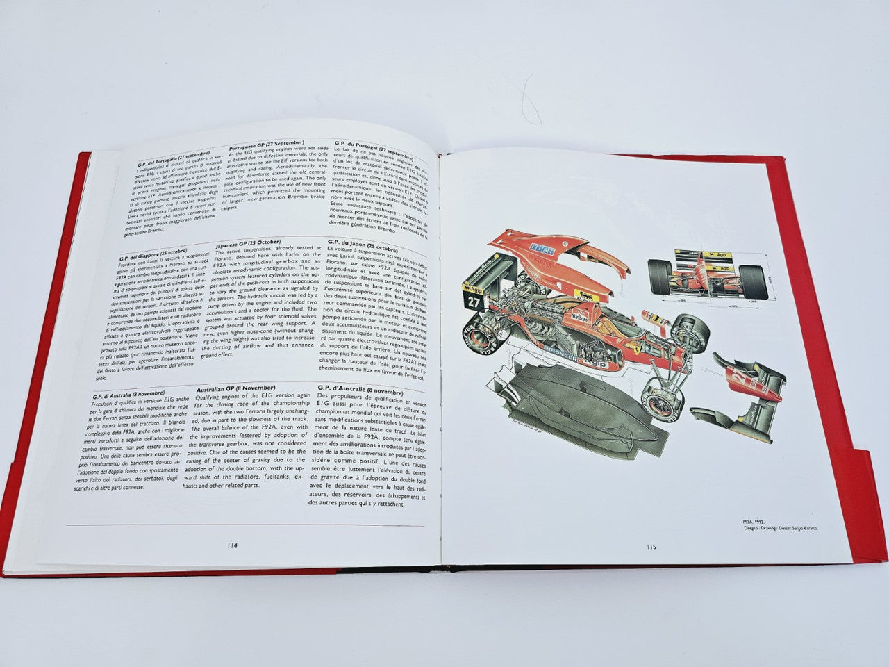 Open book with technical illustration of race car and callouts on right page