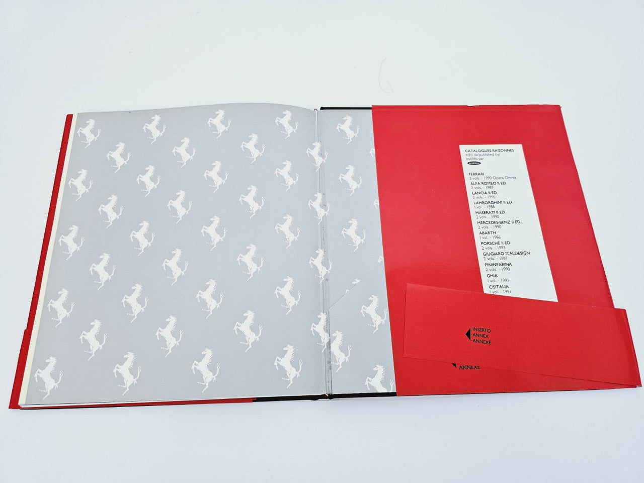 Ferrarissima No. 18 open booklet with gray patterned pages and red back cover