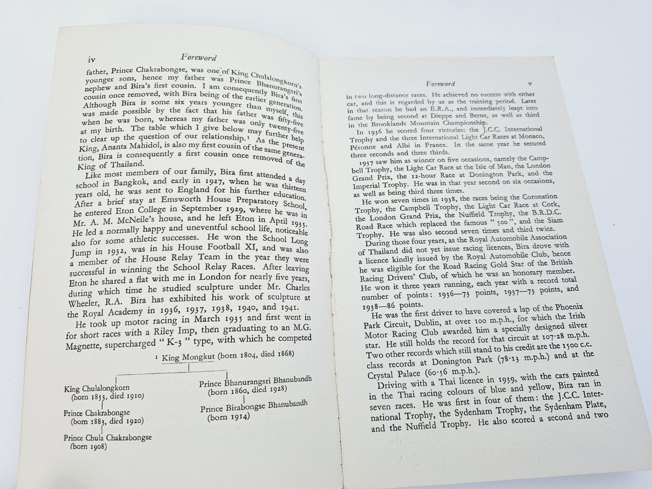 Open book with Foreword text on facing pages and handwritten signature area