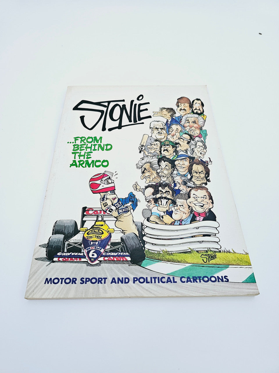 Signed cartoon collection book cover with “Stonie” title, characters, cars, and text