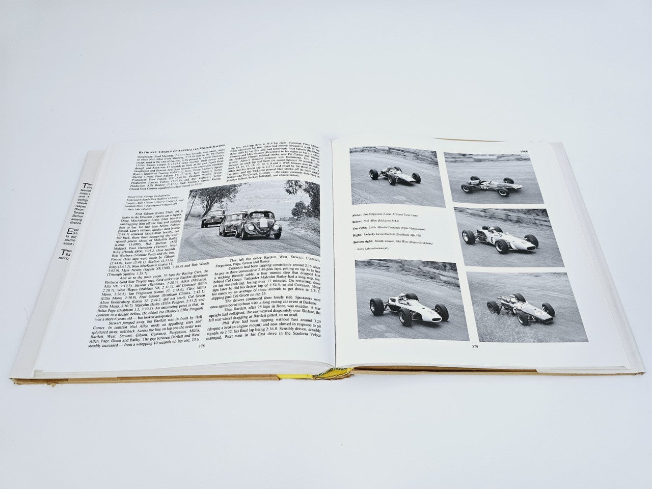 Open book showing black-and-white race car photos across two page spreads