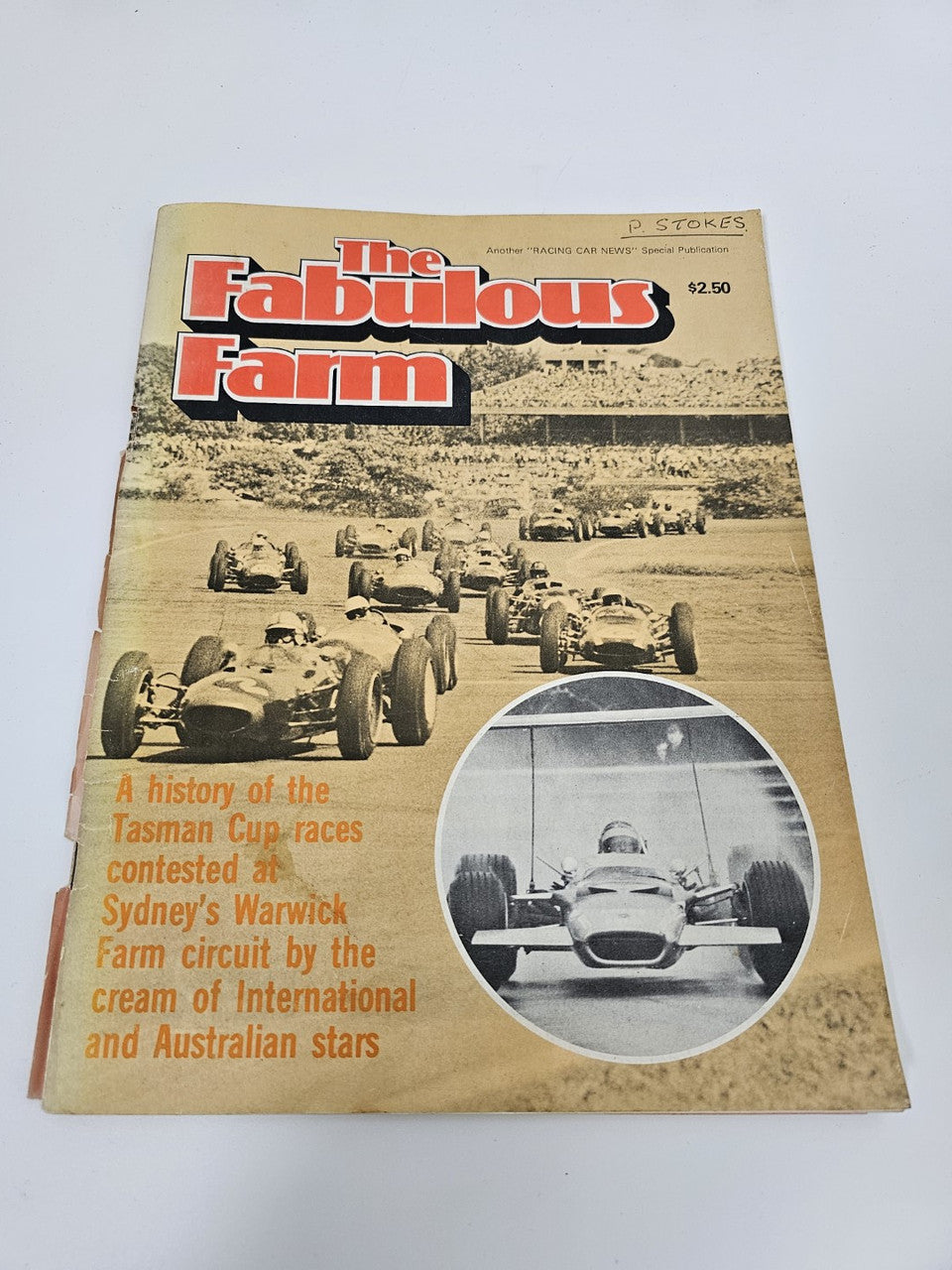 Vintage racing magazine cover with bold red-and-black title and oval car photo