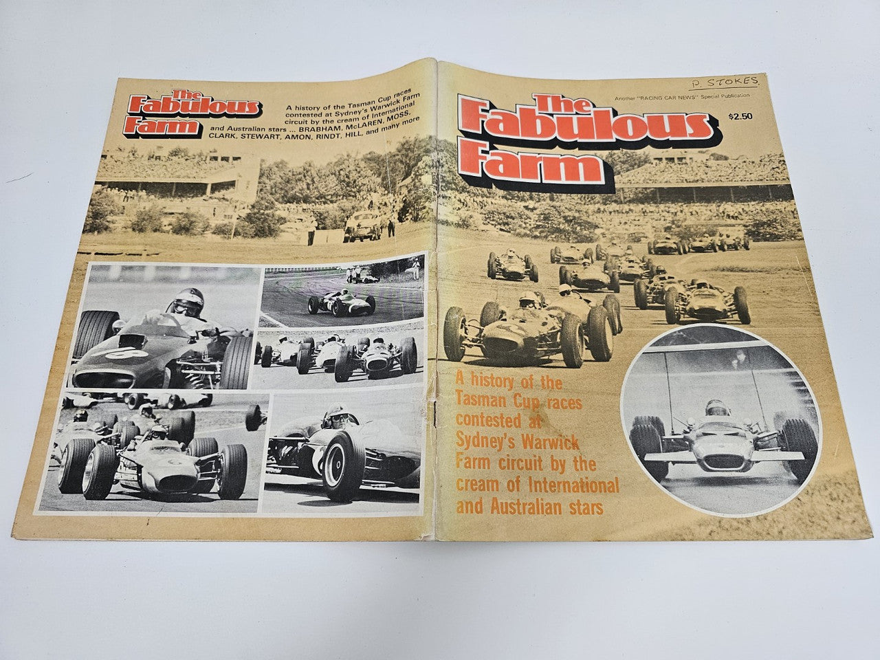 Vintage racing magazine open spread with large title text and oval car photo