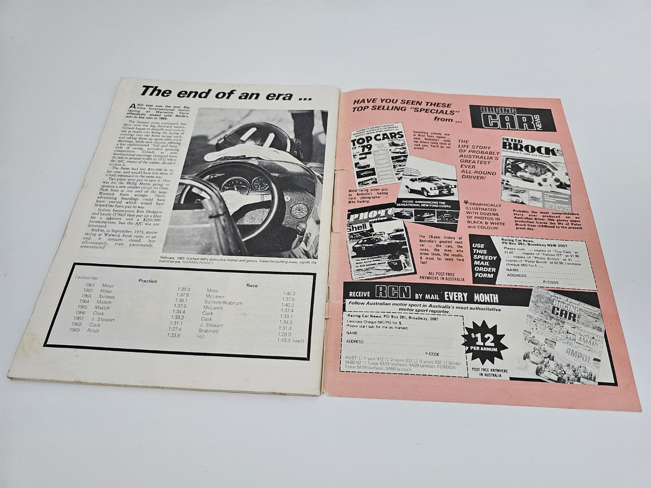 Vintage motorsport magazine open spread with car cockpit photo and stats page