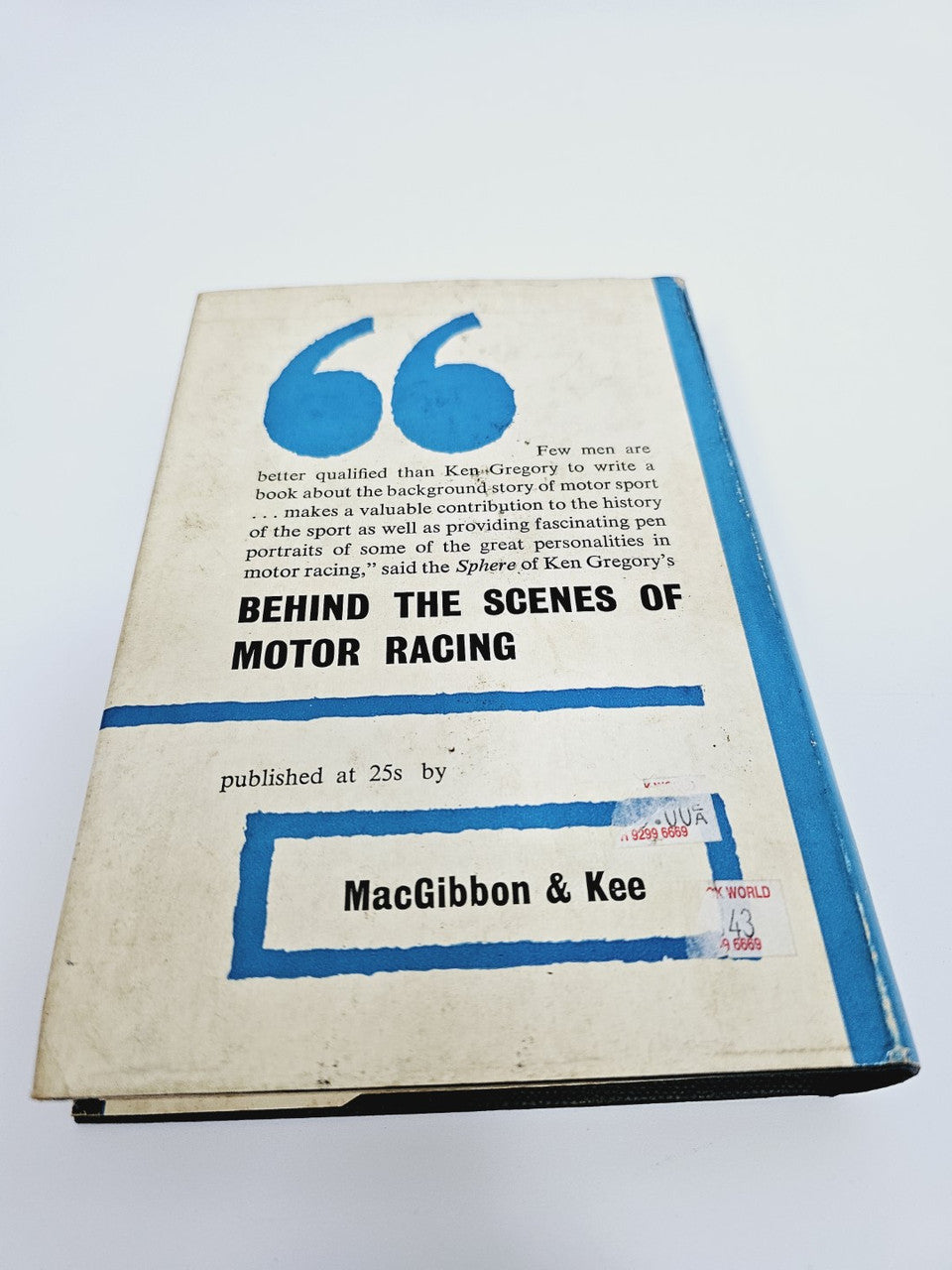 Motor racing book with blue-and-white cover titled "Behind the Scenes of Motor Racing".