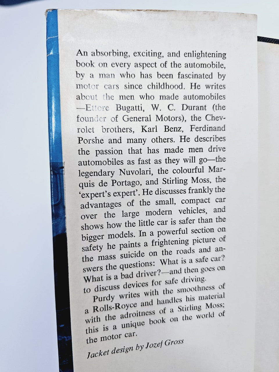 Opened automobile book page with dense printed paragraphs.