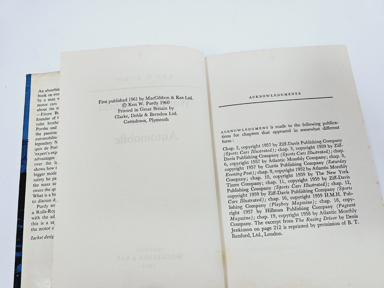 Opened automobile book showing "Acknowledgements" page with publication details.