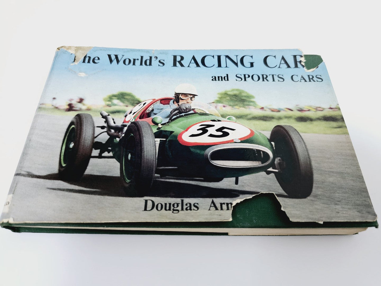 Front cover of vintage racing cars and sports cars hardcover book with car photo