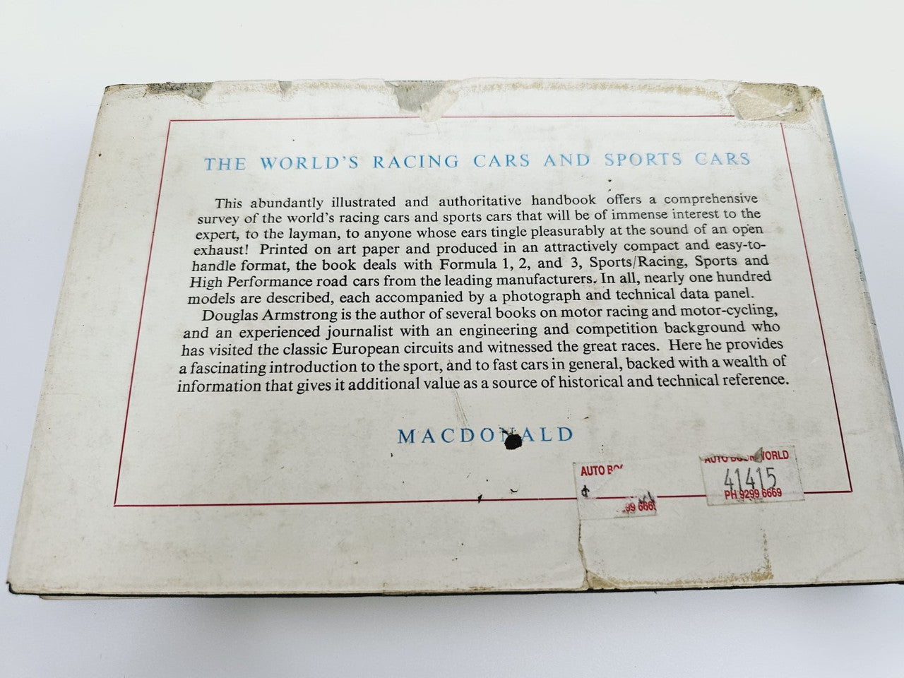 Vintage hardcover racing cars and sports cars handbook with title and description text
