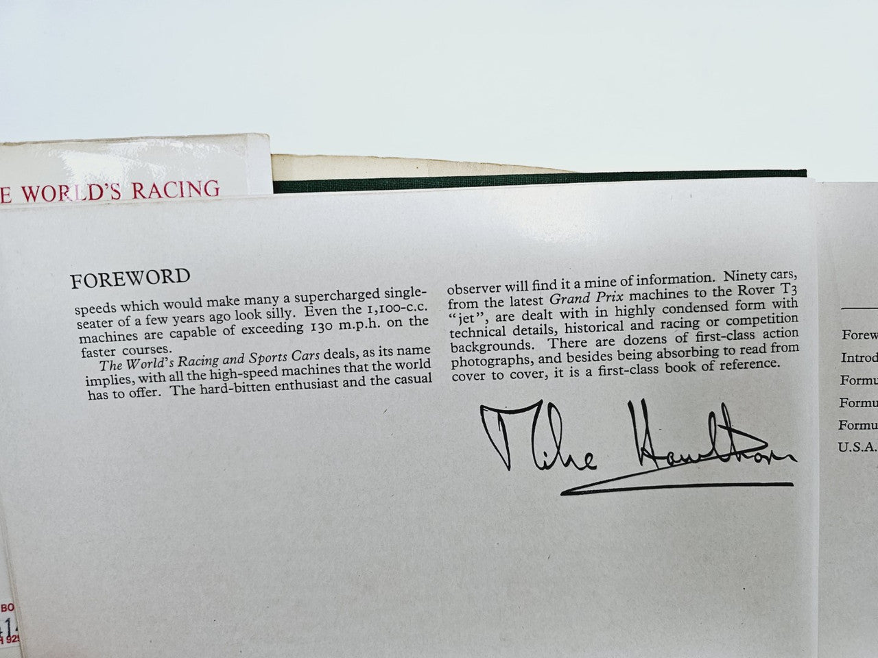 Paperback page spread with “FOREWORD” section and handwritten author signature