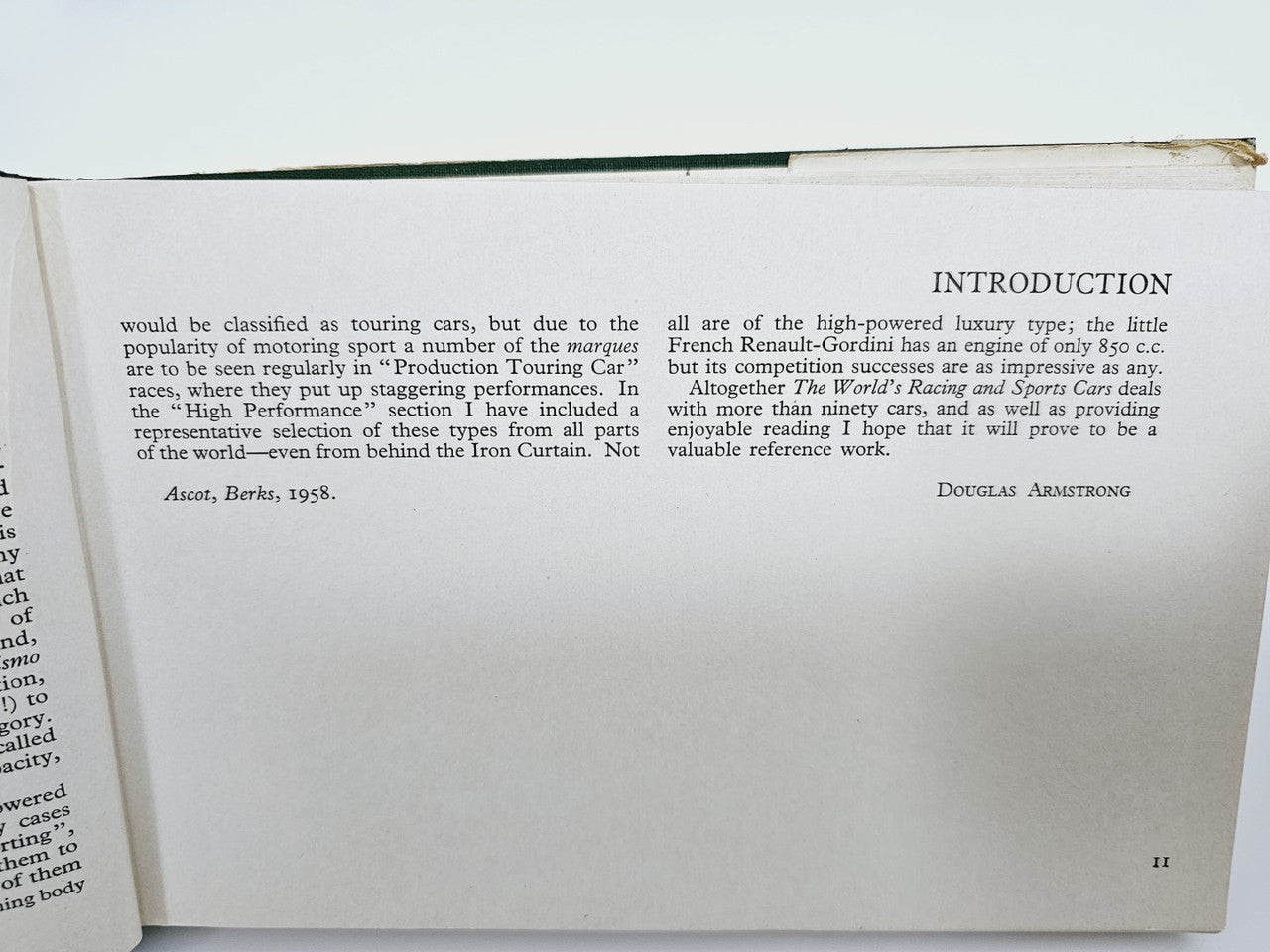 Open vintage racing cars book page labeled “INTRODUCTION” with printed paragraphs