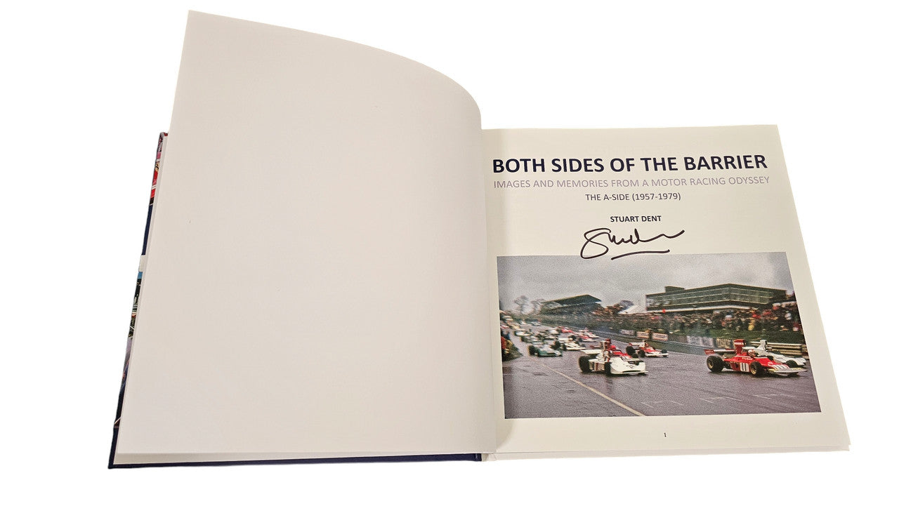 Signed racing history book open to a spread with a photo and printed title