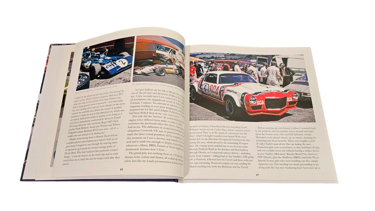 Signed racing history book open to pages with multiple racing photos and text