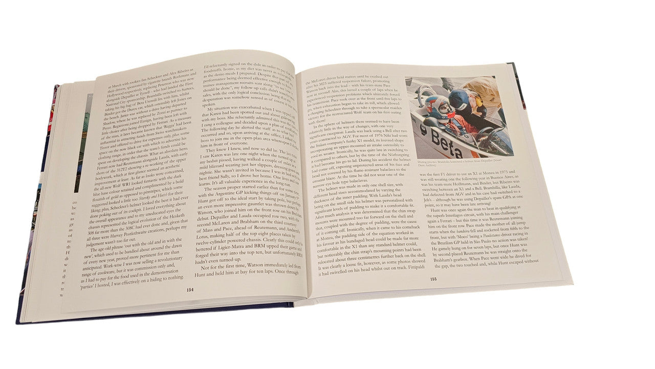 Open hardcover book with racing images and dense text across both pages