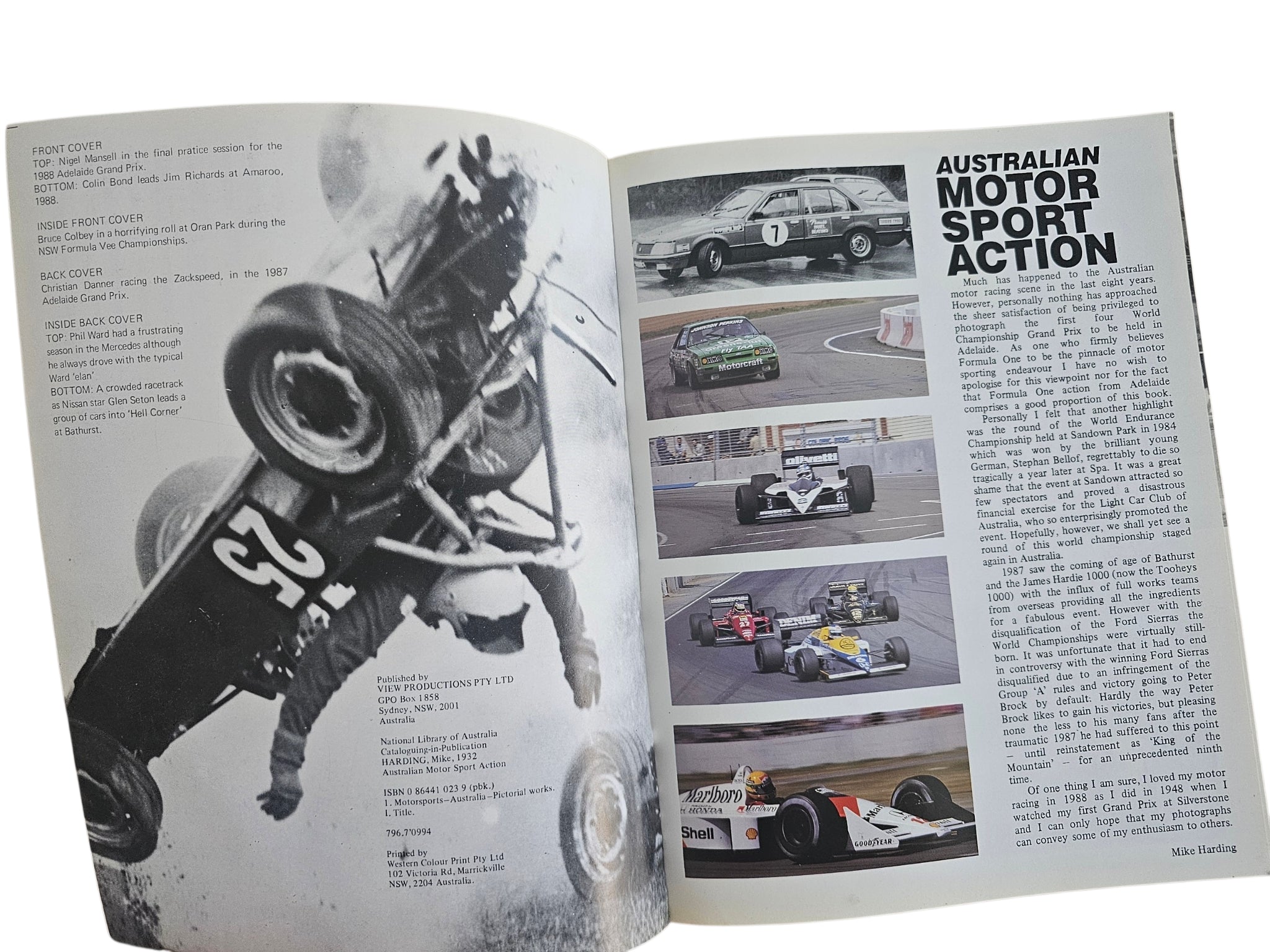 Motorsport action book spread with driver on motorcycle-style race bike and article page