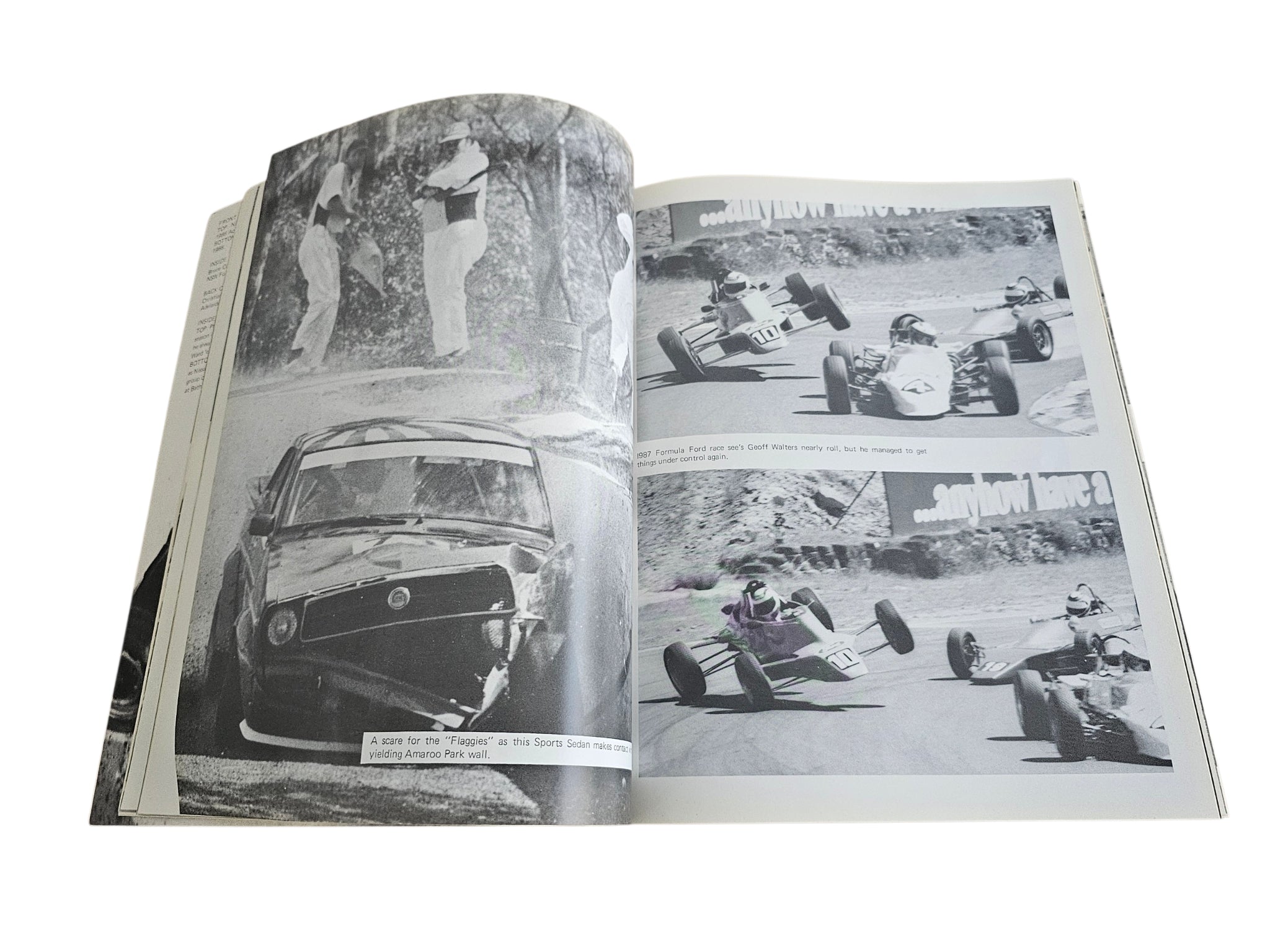 Motorsport action book spread with black-and-white cars on track and pit area photos