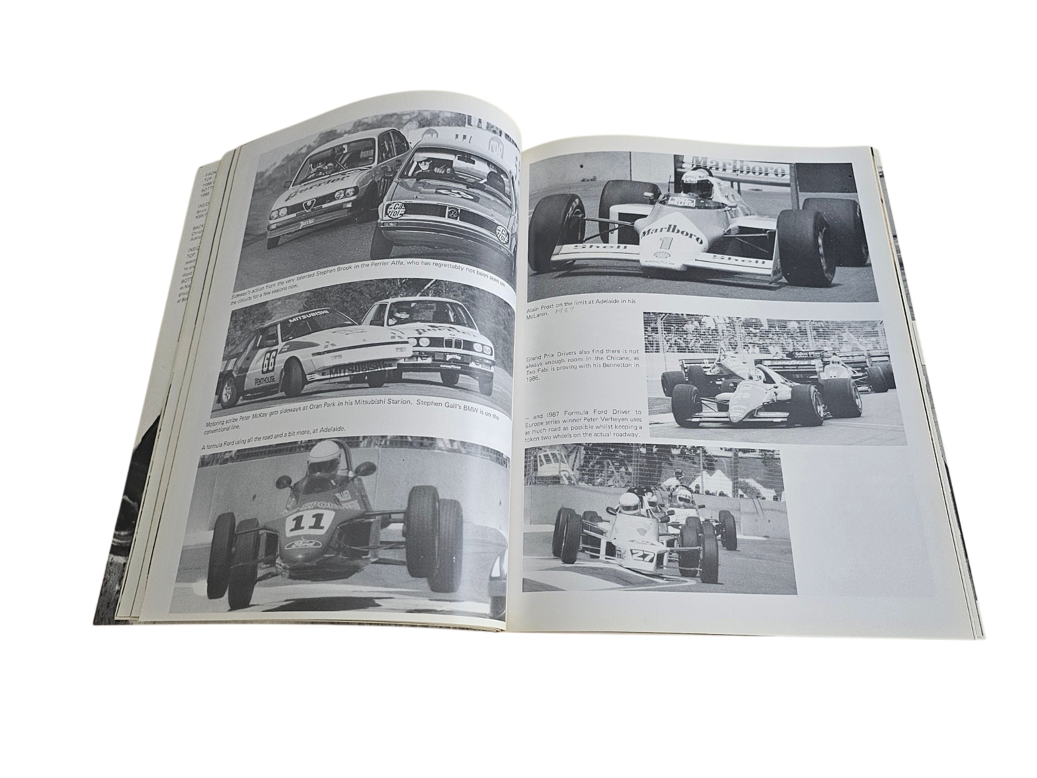 Motorsport action book spread with black-and-white car and pit photos
