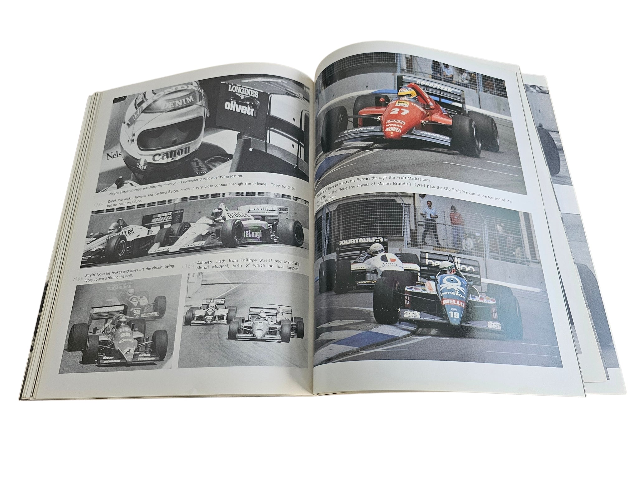 Open motorsport action book showing two-page spread of race photos and captions