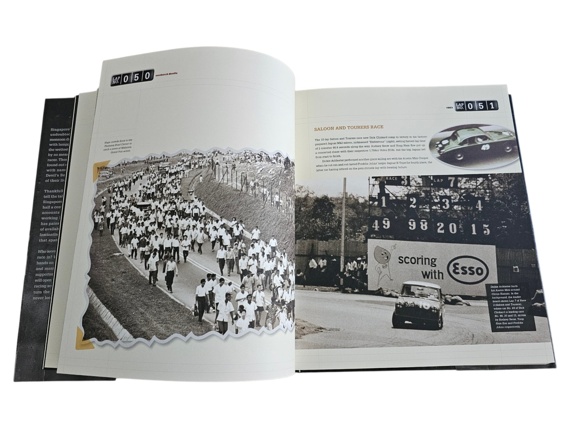 Signed motorsport history book, open spread with crowd photo and race track image