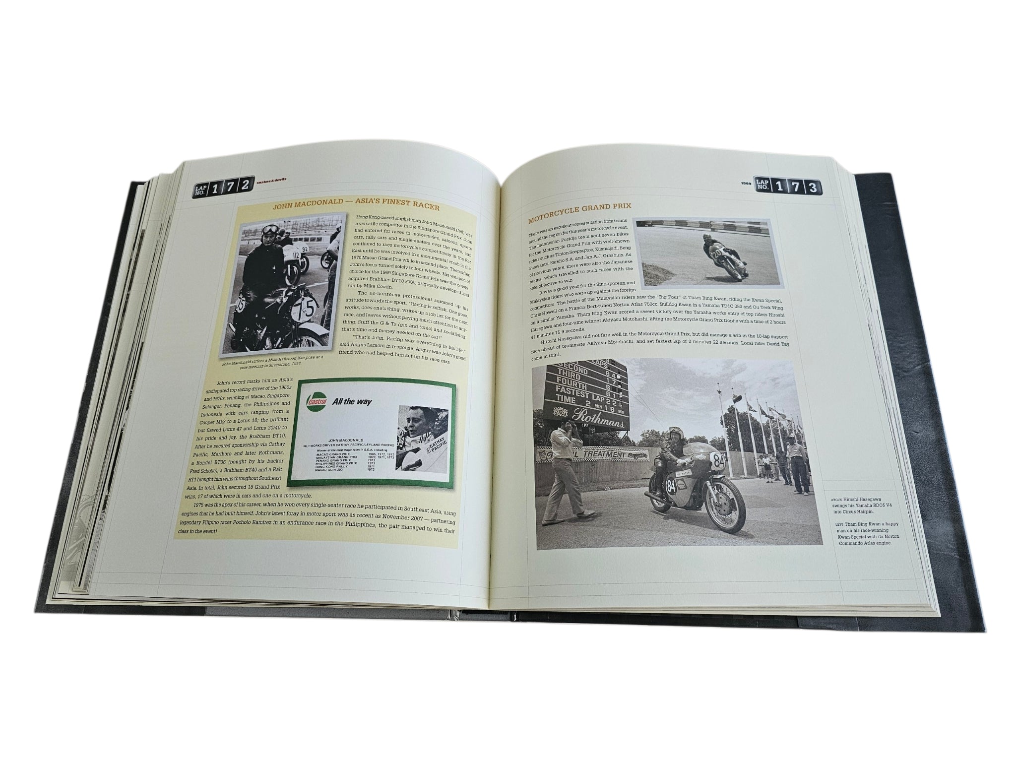Signed Singapore Grand Prix history book, open with text blocks and motorcycle images