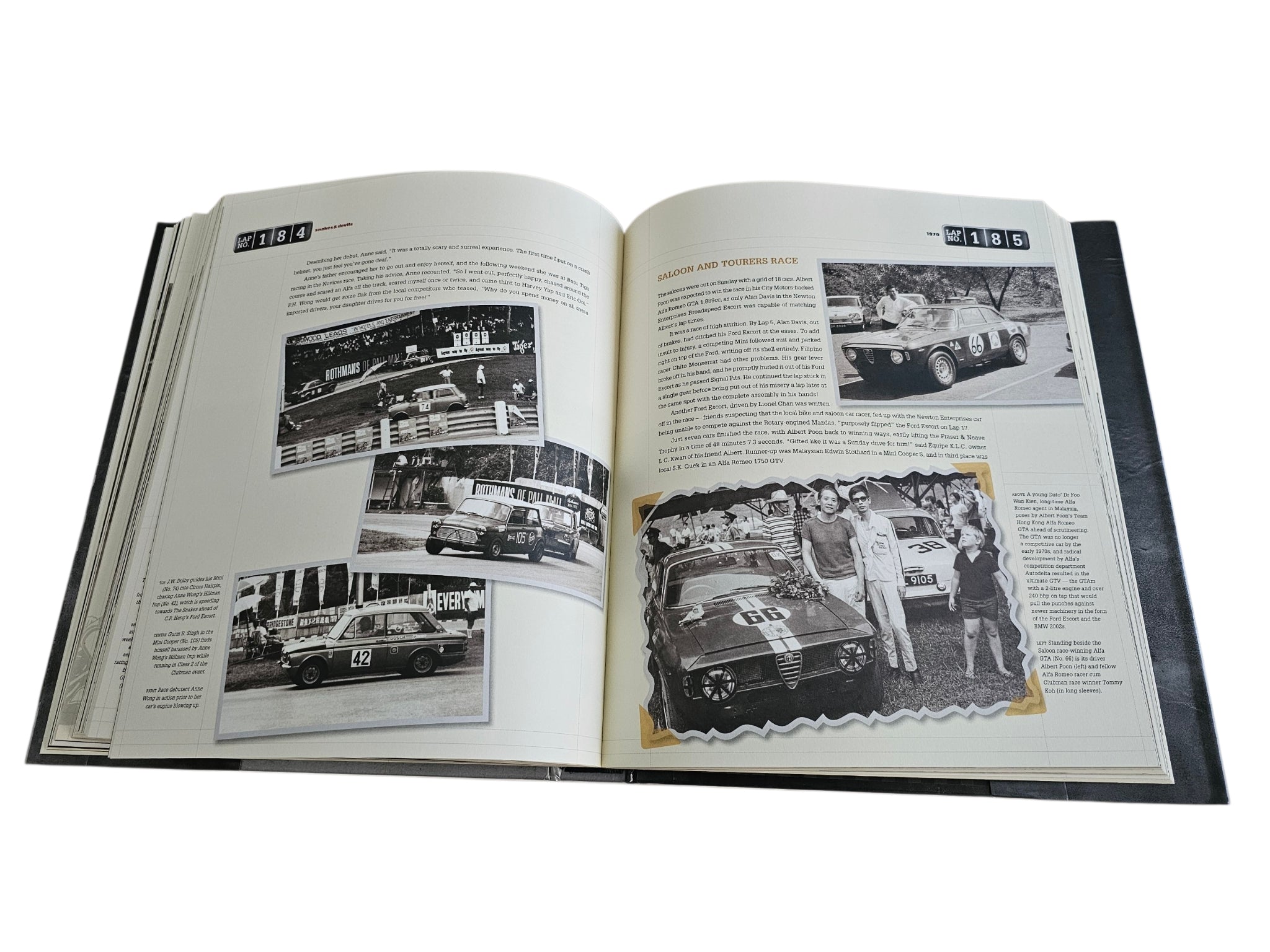 Signed Singapore Grand Prix history book, open pages with car photos and captions