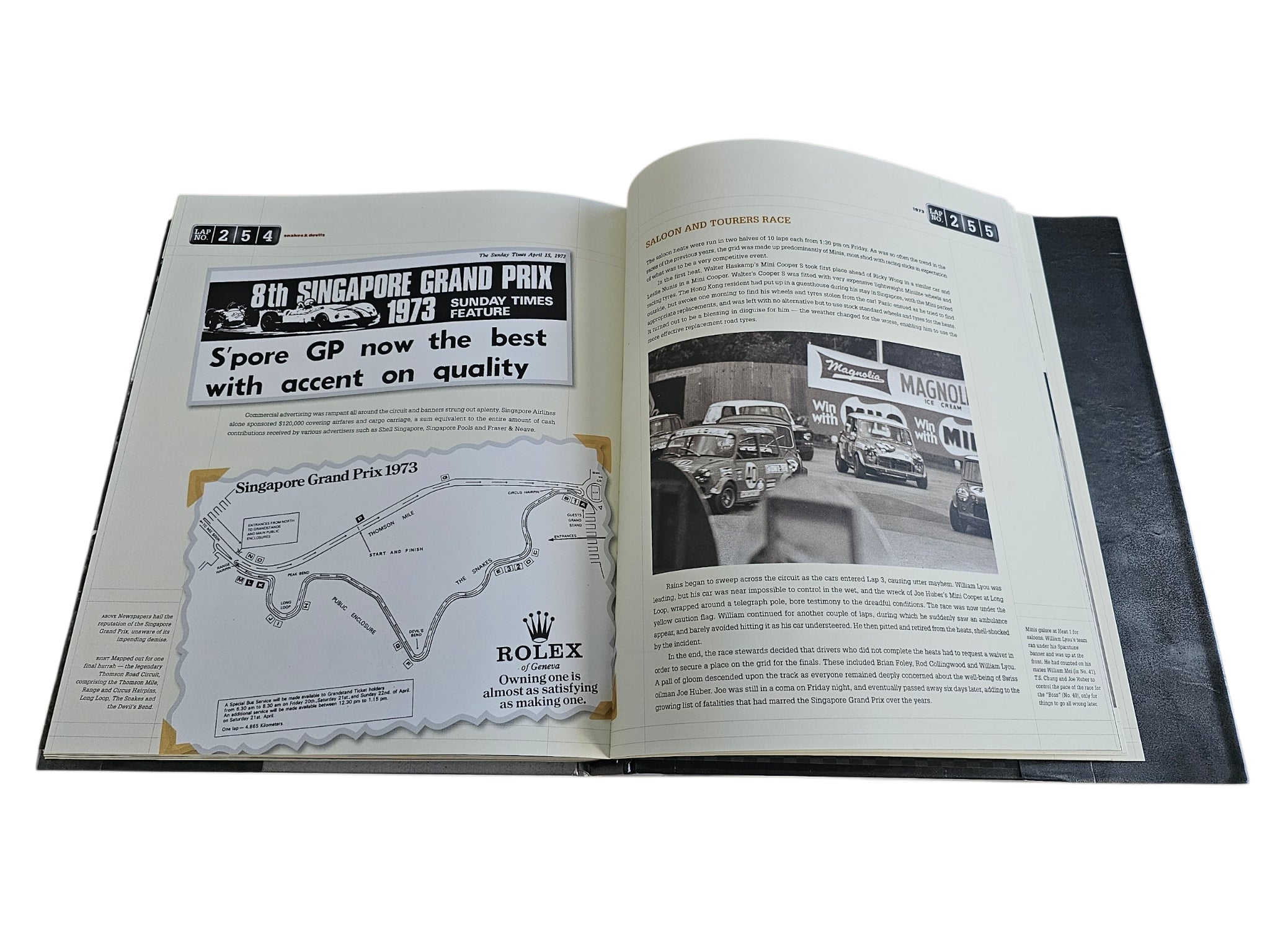 Signed motorsport history book, open spread with map and vintage race program page