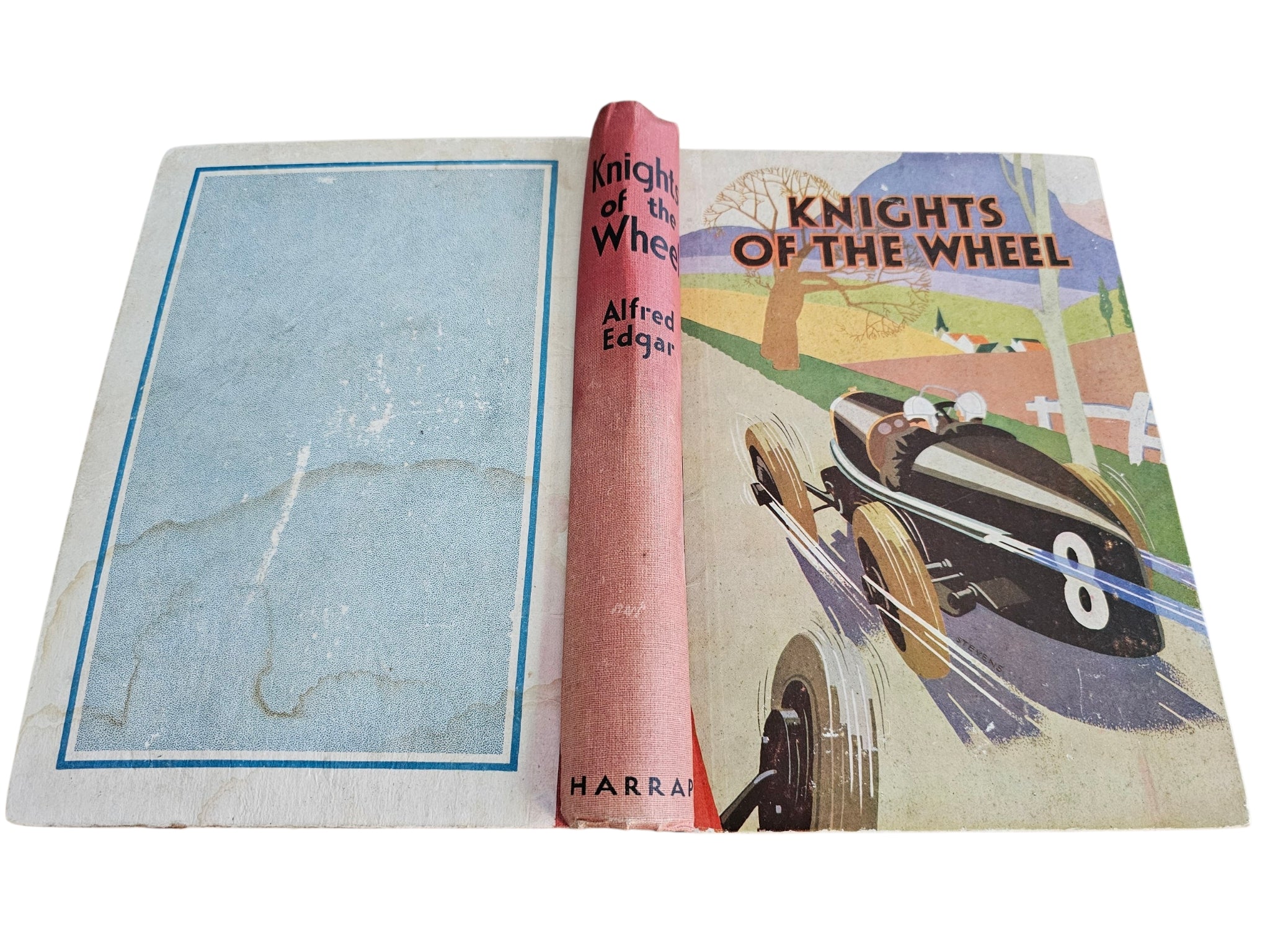 Knights of the Wheel book open flat, showing front cover and blank inner page