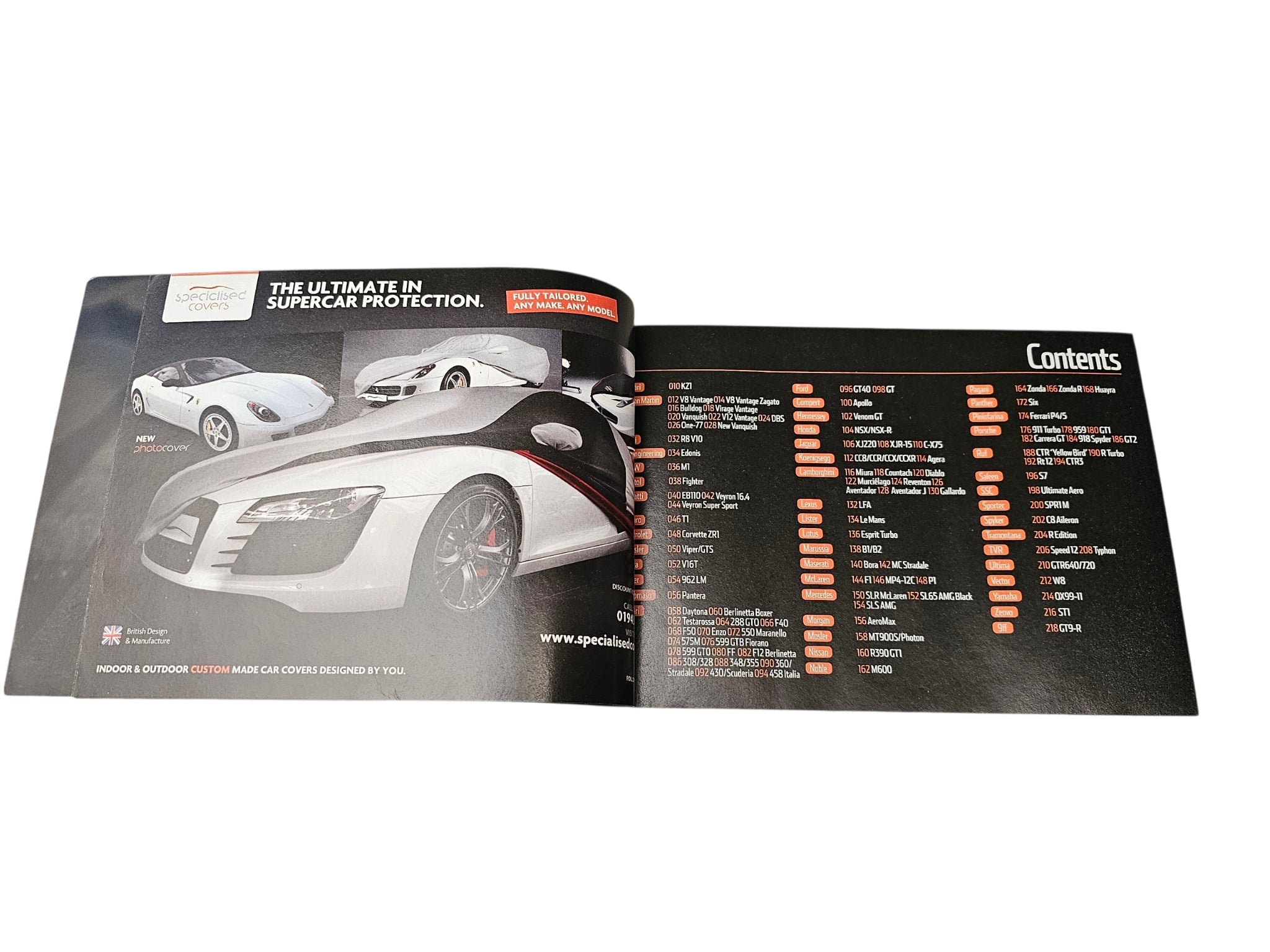 Supercar guide book open spread with monochrome car image and contents list