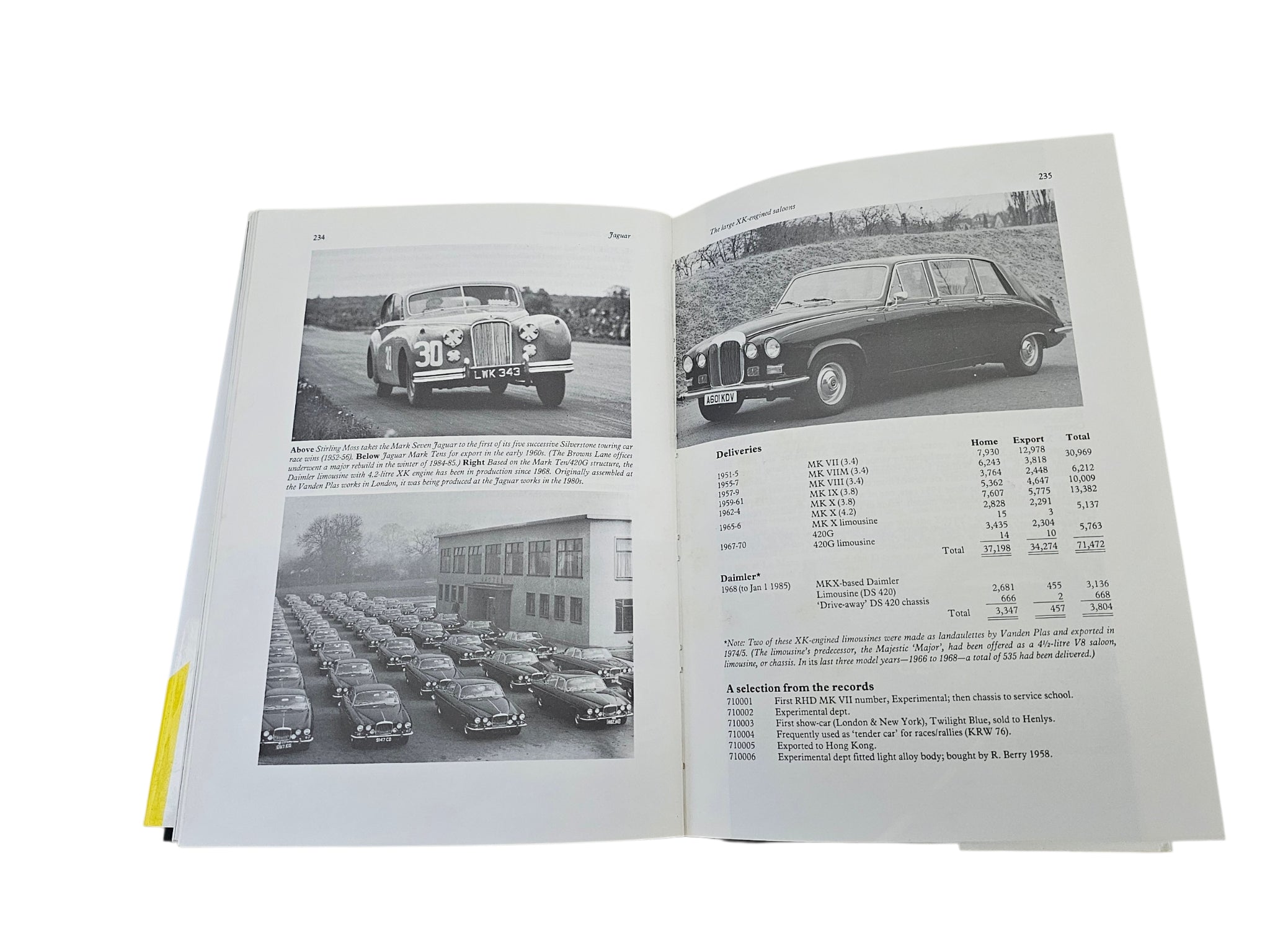 Open car history book with racing and event photos plus a specifications table