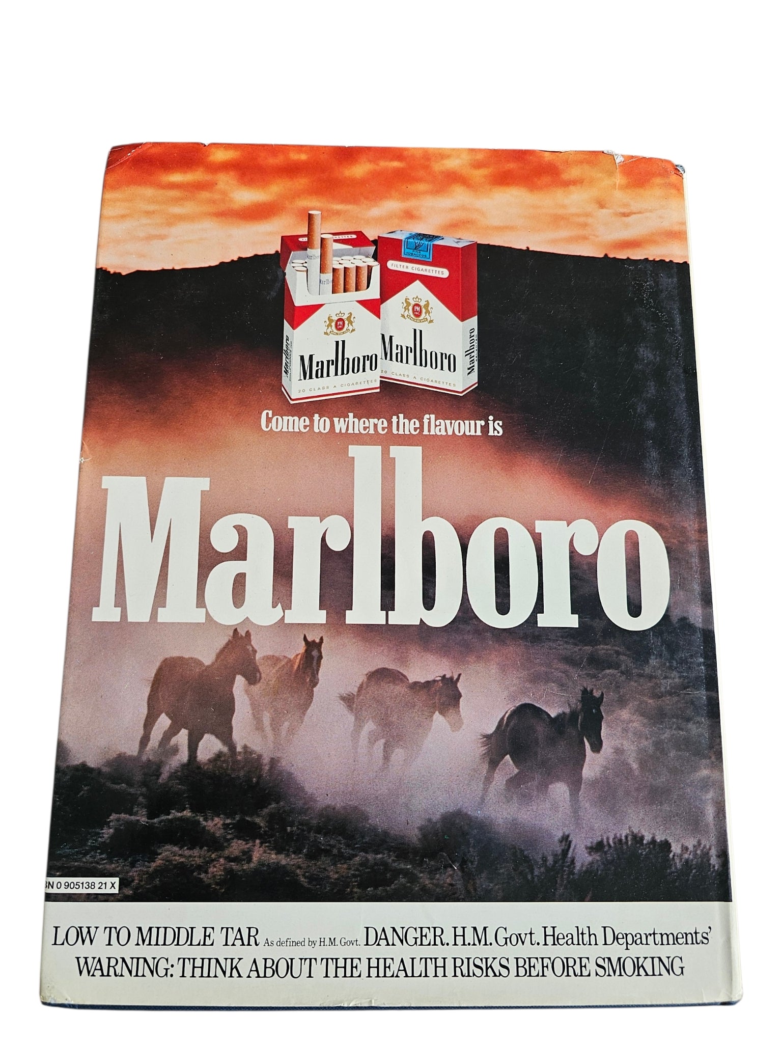 Racing book cover with Marlboro logo, horses artwork, and scenic sky background