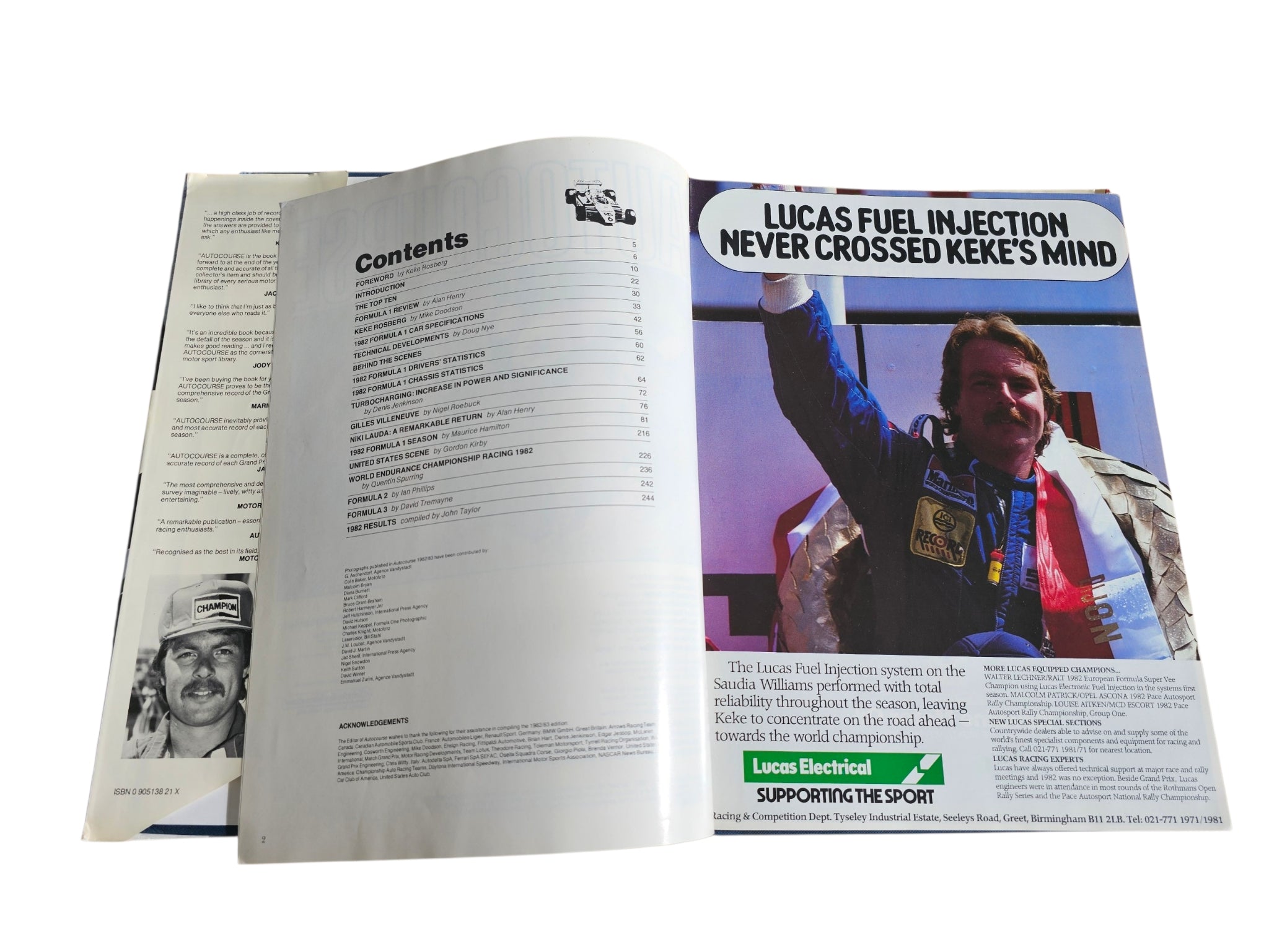 Open racing book spread with “Lucas Fuel Injection” headline and portrait